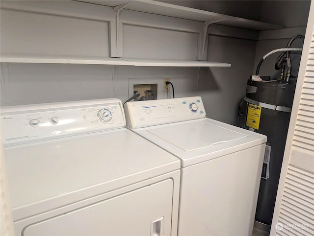 laundry area featuring washing machine and dryer and gas water heater