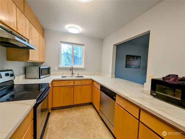 kitchen featuring black appliances, sink, light stone counters, kitchen peninsula, and extractor fan