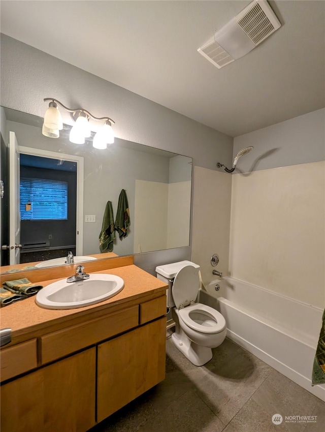 full bathroom with shower / washtub combination, vanity, and toilet