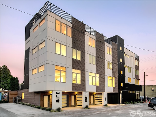 view of outdoor building at dusk