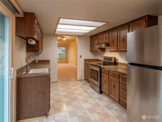 kitchen with appliances with stainless steel finishes and sink