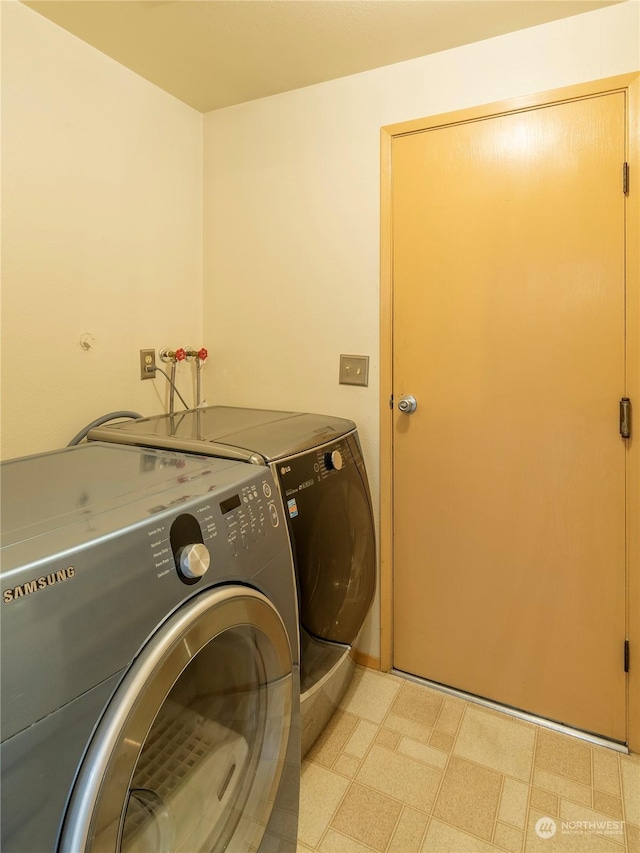 washroom featuring washing machine and dryer