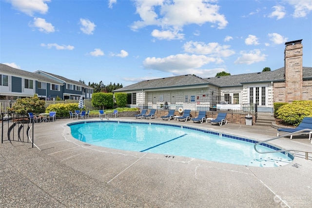 view of swimming pool featuring a patio area