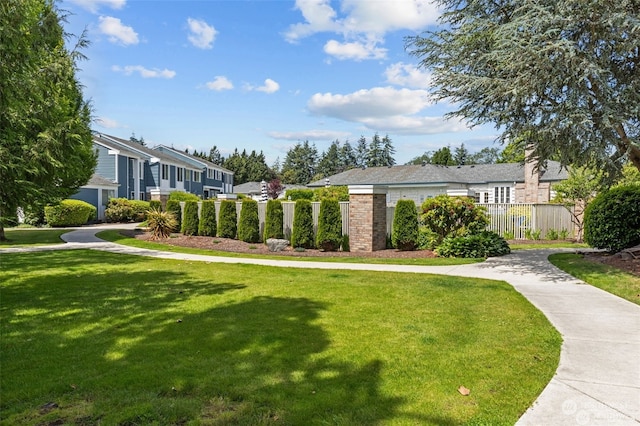 view of property's community with a yard