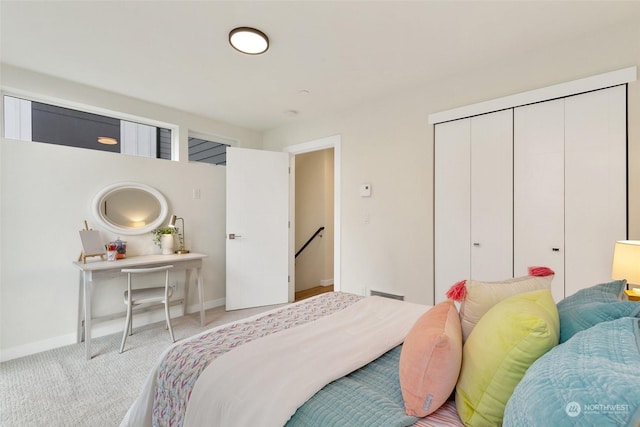 bedroom featuring light carpet