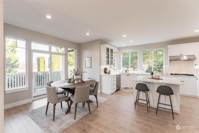 dining space featuring a healthy amount of sunlight and light wood-type flooring