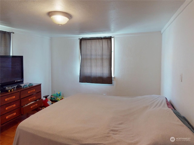 bedroom featuring hardwood / wood-style flooring