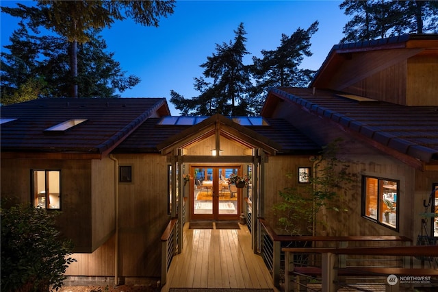 exterior entry at dusk with french doors