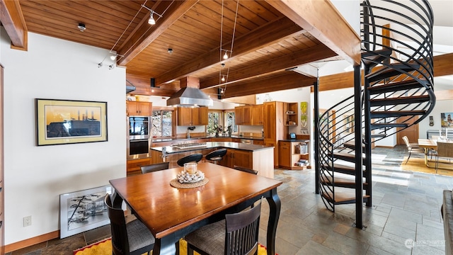 dining area featuring beamed ceiling, wooden ceiling, and rail lighting