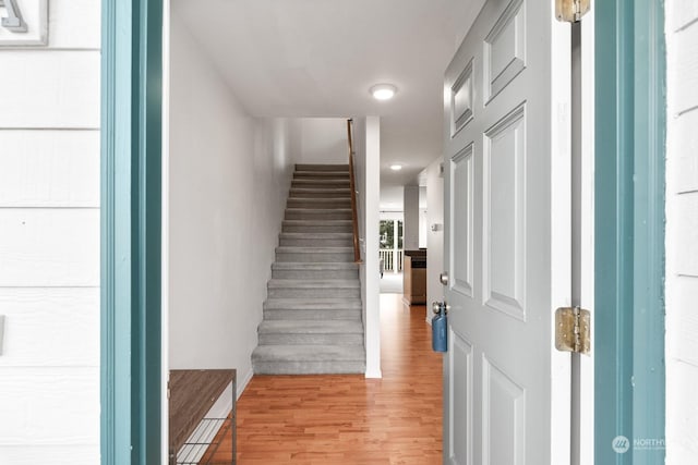 staircase featuring hardwood / wood-style flooring