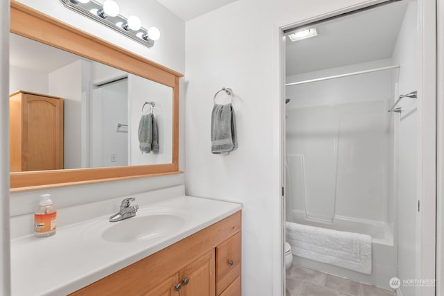 bathroom featuring vanity, toilet, and walk in shower