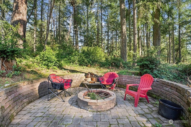 view of patio / terrace with an outdoor fire pit