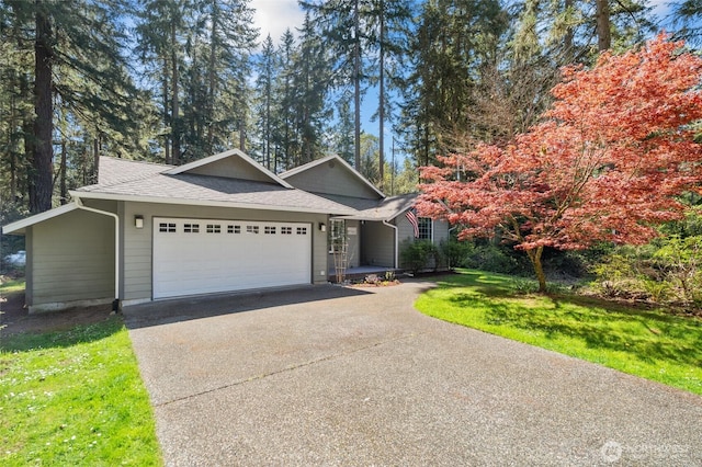 10405 Olympic Pl, Anderson Island, WA 98303 - single story home featuring a garage, a shingled roof, a front yard, and concrete driveway