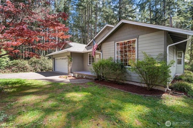 10405 Olympic Pl, Anderson Island, WA 98303 - single story home with an attached garage, aphalt driveway, and a front yard