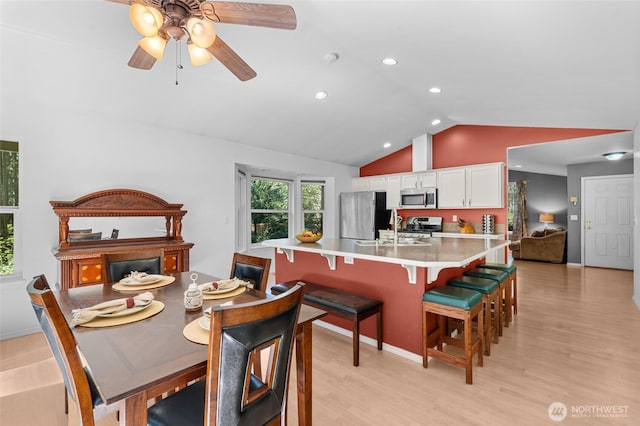 10405 Olympic Pl, Anderson Island, WA 98303 - dining area featuring recessed lighting, ceiling fan, vaulted ceiling, and light wood-type flooring