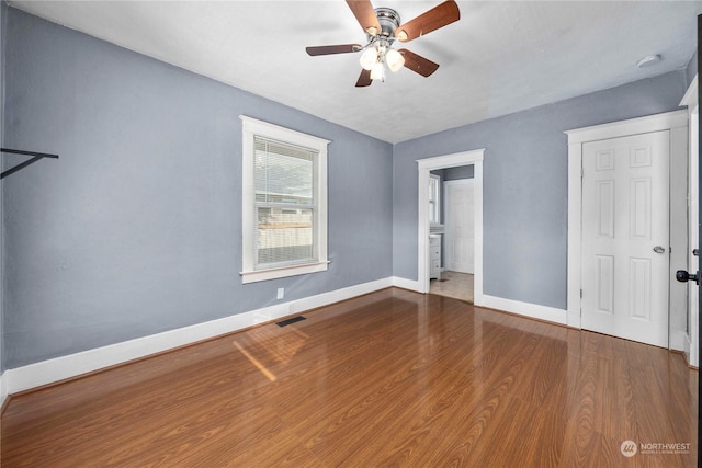 unfurnished bedroom with hardwood / wood-style floors and ceiling fan