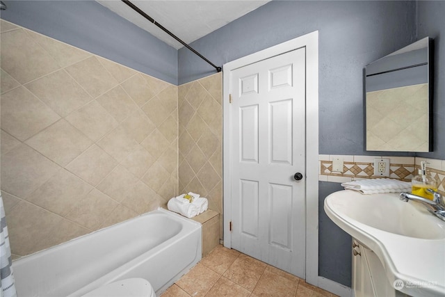 bathroom featuring shower / bathing tub combination, tile patterned floors, and vanity