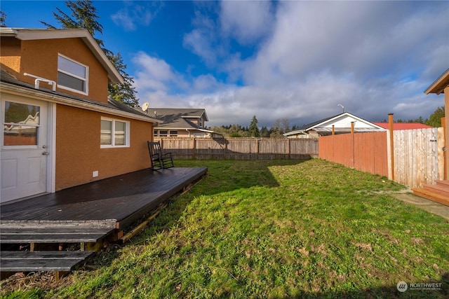 view of yard featuring a wooden deck