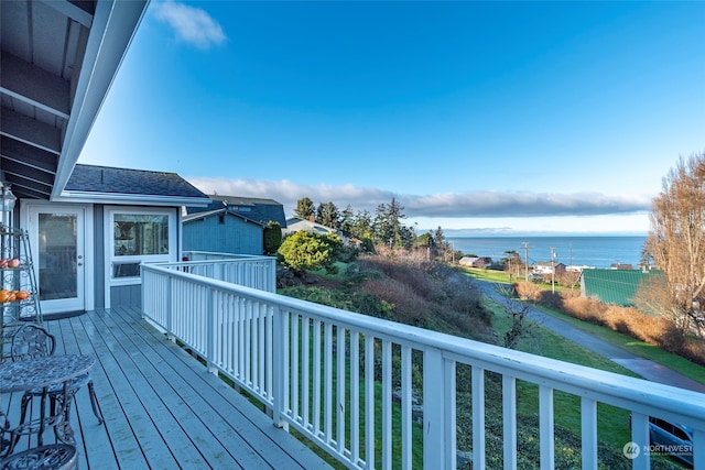 wooden deck with a water view