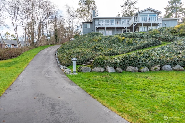 exterior space featuring a deck and a yard