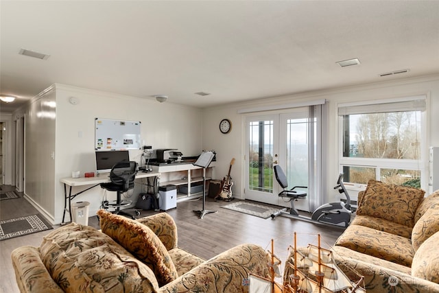 home office featuring dark hardwood / wood-style floors, crown molding, and french doors