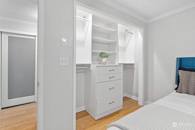 bedroom with hardwood / wood-style flooring and ornamental molding