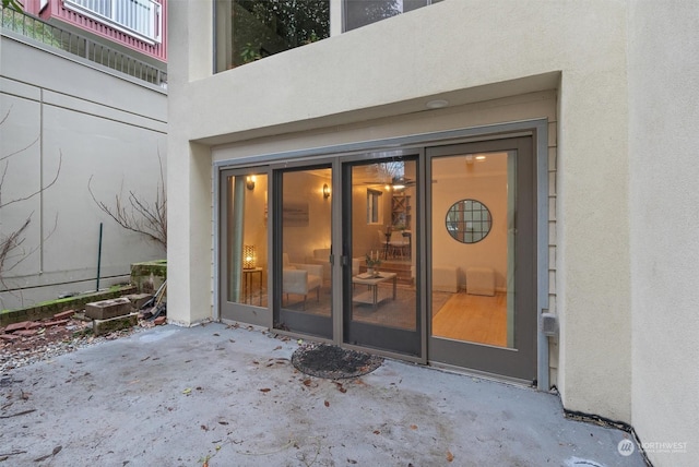 entrance to property with a patio area