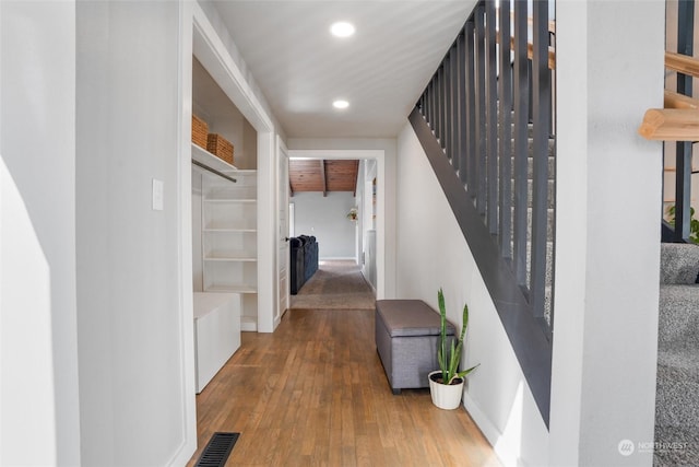 hall featuring wood-type flooring