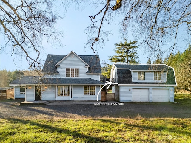 view of front facade with a garage and a front lawn