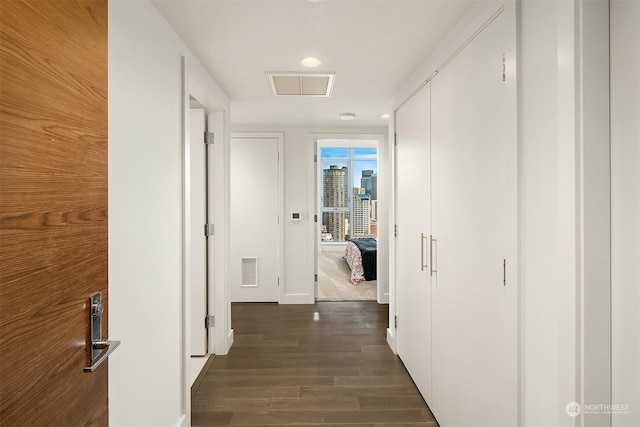 hallway featuring dark wood-type flooring