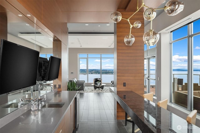 kitchen with dishwasher, sink, and decorative light fixtures