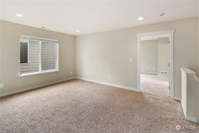 spare room featuring carpet floors