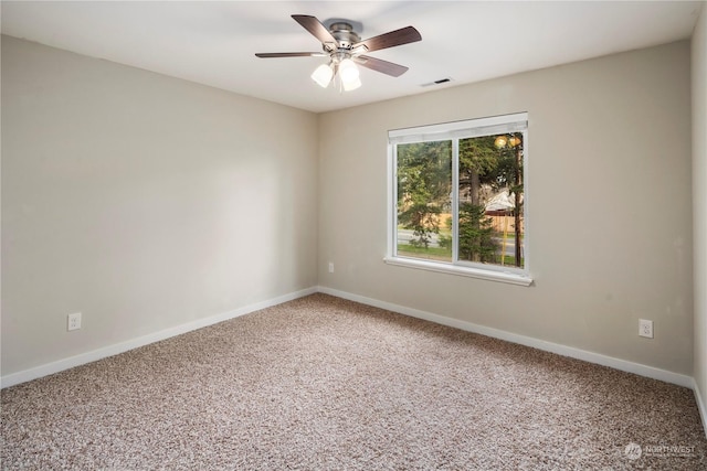 spare room with ceiling fan and carpet flooring