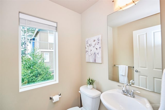 bathroom featuring toilet and sink