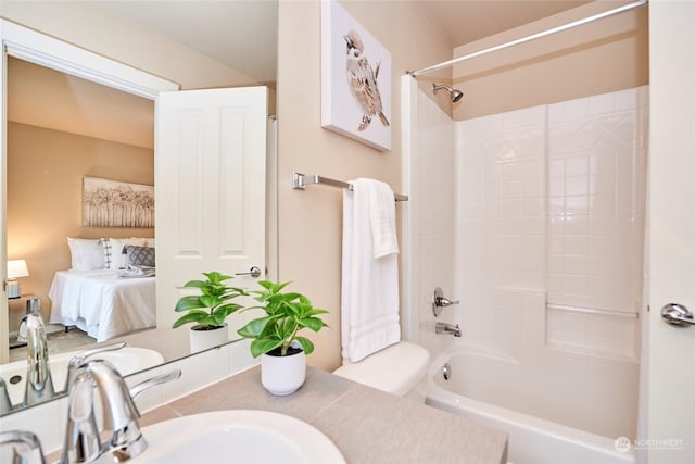 bathroom with shower / washtub combination and sink