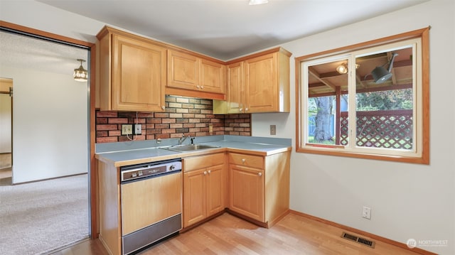 kitchen with dishwasher, light hardwood / wood-style flooring, light brown cabinetry, decorative backsplash, and sink