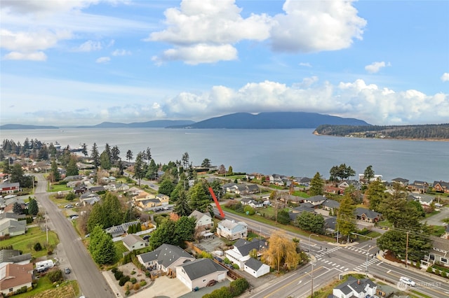 aerial view featuring a water and mountain view