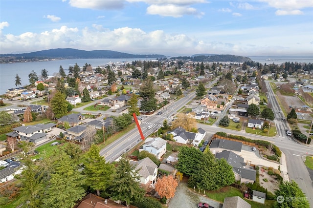 aerial view featuring a water and mountain view