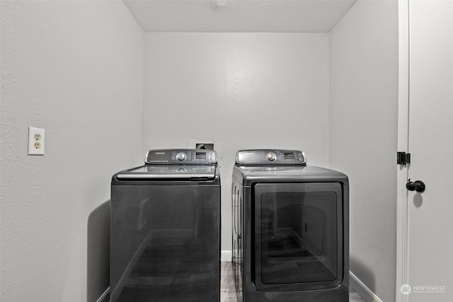4626 143rd St E, Tacoma, WA 98446 - clothes washing area featuring a textured ceiling and washer and clothes dryer