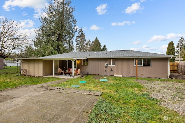 4626 143rd St E, Tacoma, WA 98446 - back of house featuring a lawn and a patio