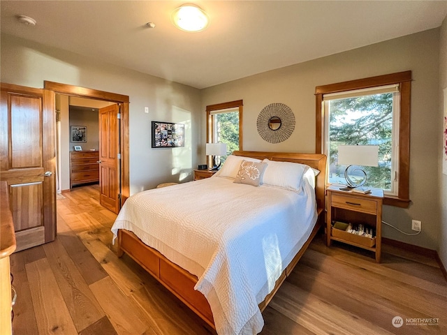 bedroom with hardwood / wood-style flooring