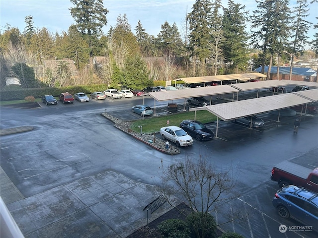 view of parking / parking lot featuring a carport