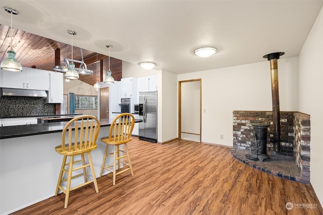 kitchen featuring tasteful backsplash, stainless steel fridge with ice dispenser, light hardwood / wood-style flooring, and white cabinets