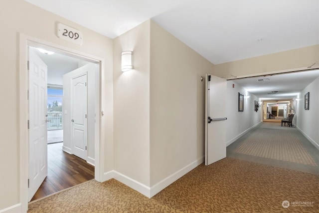 hallway featuring dark hardwood / wood-style floors