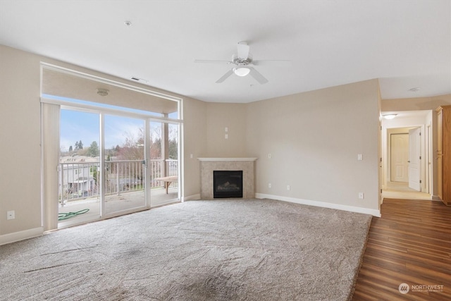 1548 River Rd Unit 209, Longview, WA 98632 - unfurnished living room featuring ceiling fan and dark wood-type flooring