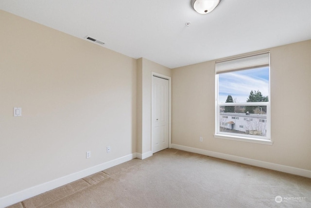 1548 River Rd Unit 209, Longview, WA 98632 - unfurnished bedroom with a closet and light colored carpet