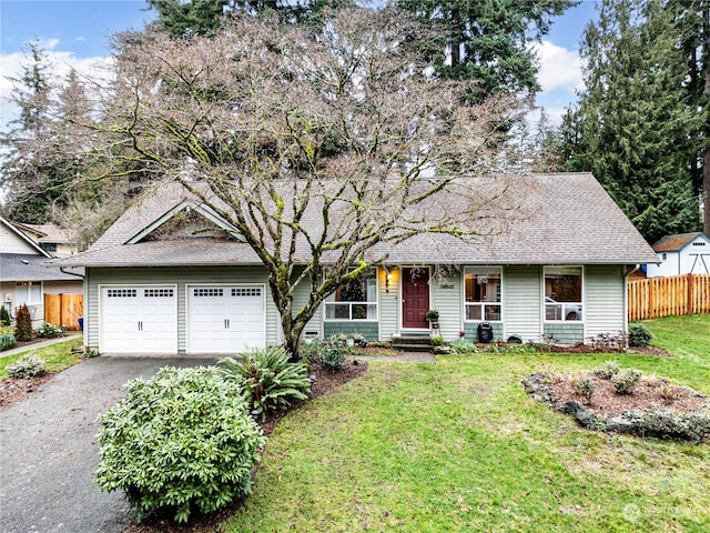 view of front of home with a garage and a front yard