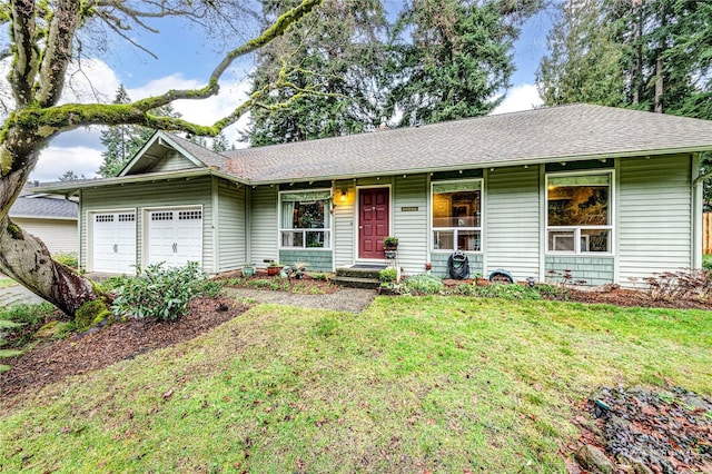 single story home featuring a front yard and a garage