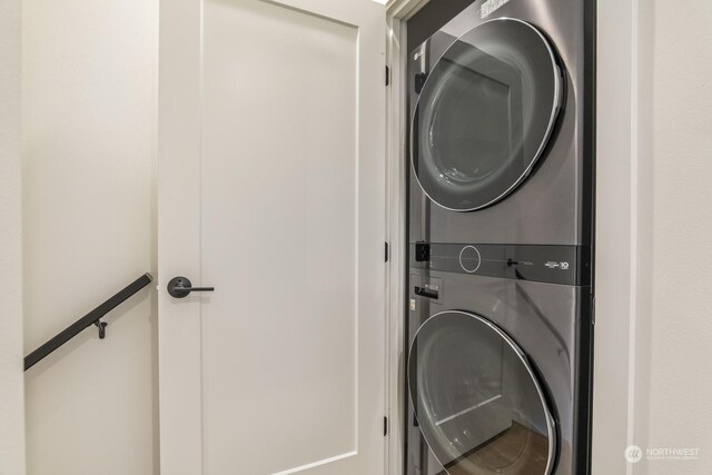 washroom featuring laundry area and stacked washing maching and dryer