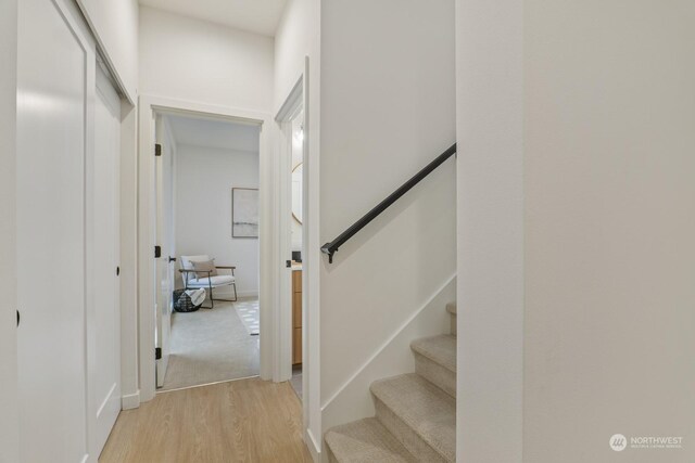 staircase with wood finished floors